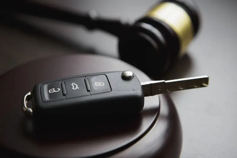 A snapshot of car keys representing a list of steps to take to reinstate a license after a second DUI conviction