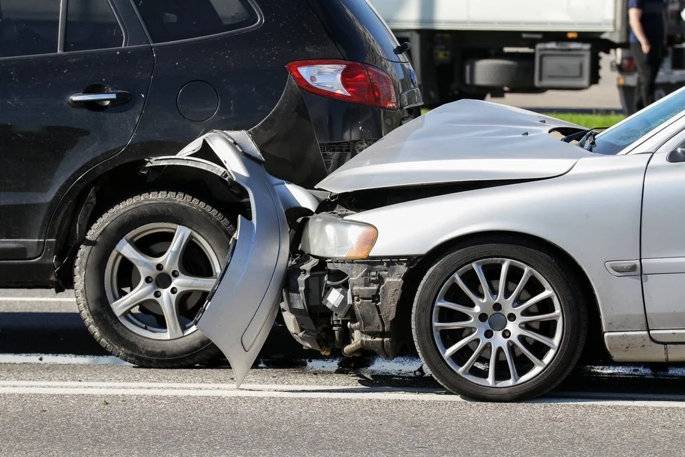 A photo of a car crash scene being investigated by a skilled car accident lawyer in West Palm Beach.